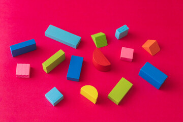 Colorful Wooden Toy Blocks On red Background