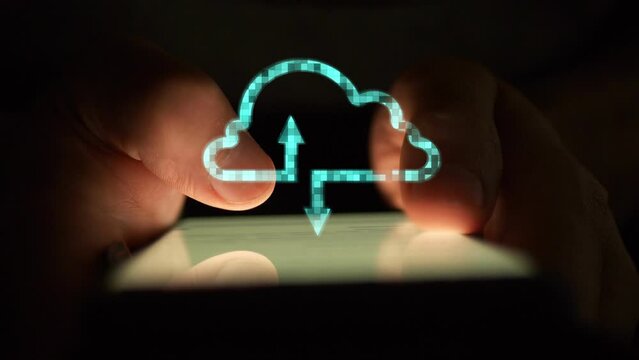 Cg footage Against the background of using a smartphone in the dark, a digital cloud of information storage is shining brightly