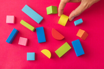 Colorful Wooden Toy Blocks On red Background