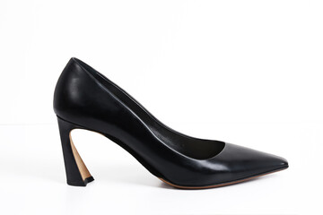 Women's high-heeled shoes made of black leather on a white background