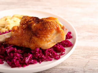 Roast turkey wing over red cabbage salad