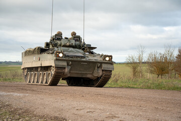 close-up of a British army Warrior FV510 Infantry Fighting Vehicle in action on a military exercise