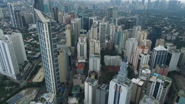 Manila Makati City in Philippines. Cityscape Skyline and Business Skyscrapers in Background. Manila Business District Traffic.