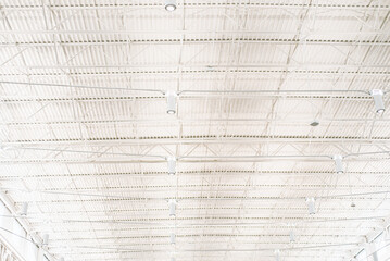 Modern steel ceiling warehouse with roof beam lights, ceiling mounted wireless router, perimeter track corresponding membrane clicks into, spacious pavilion exhibitions, public library Frisco - obrazy, fototapety, plakaty