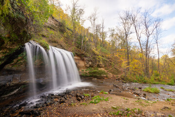 Fototapeta premium waterfall in autumn, fall colors 