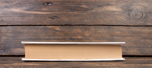 Stack of white books. Education background. Back to school. Book, hardback books on wooden table. Education business concept. Copy space for text. panorama, banner.