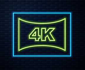 Glowing neon line Screen tv with 4k Ultra HD video technology icon isolated on brick wall background. Vector