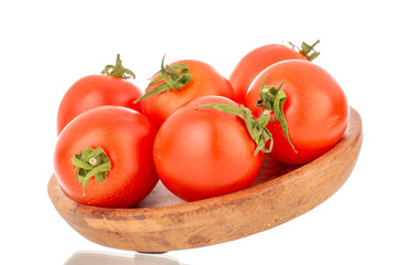 Several ripe cherry tomatoes with a wooden plate, macro, isolated on white background.