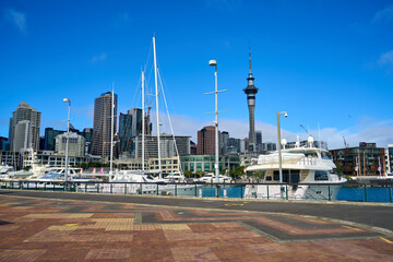 Walking street along Auckland's viaduct harbor waterfront on a sunny winter day in Auckland, New...