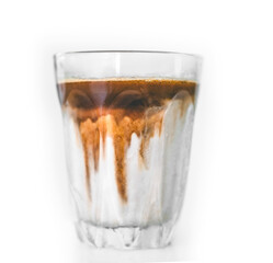 Espresso with Cream Swirl in Clear Glass, dirty coffee.