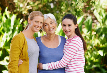 Obraz premium Portrait, woman or child as family, support or visit to relax as happy, bonding or together. Grandma, mom or girl as smile, sunshine or retirement to hug in garden on morning summer day in Hollywood