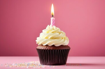 Chocolate cupcake with cream and candle on a pink background. Birthday concept.
