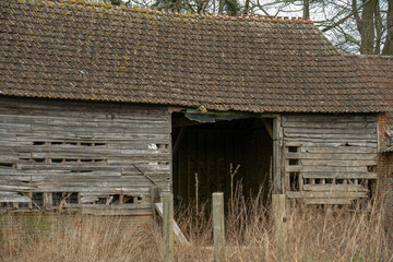abandoned farm barn outbuildings in a state of disrepair