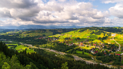 Tatra Mountains, Poland. Panorama of a mountain landscape. Late summer mountain view	with village and river