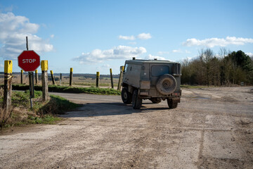 British army bae systems, Puch, Daimler, Pinzgauer High-Mobility All-Terrain 4x4 vehicle on a military battle exercise, Wilts UK © Martin