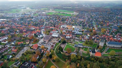 Aerial of the old town around the city Bad Bentheim in Germany on a cloudy noon in fall
