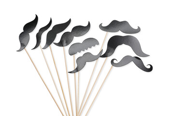 Fake paper mustaches with party props isolated on white, top view