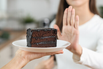 Diet, Dieting asian young woman, girl hand gesture push out rejecting eat chocolate cake, sweet...