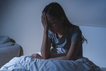 Sad worried and stressed, depressed asian young woman, girl suffering in bed from insomnia problem,...