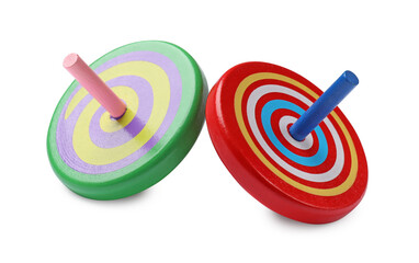 Two bright spinning tops isolated on white