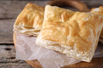 Delicious puff pastry on table, closeup view