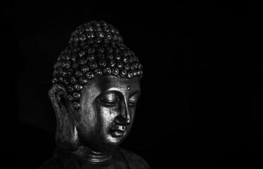 Fototapeta na wymiar buddha statue isolated on black