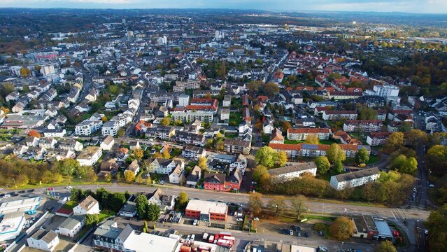 Aerial around the downtown of the city Leverkusen on a sunny day in summer in Germany.