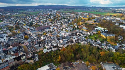 	
Aerial view around the old town of the city  Montabaur in Germany on a cloudy day in autumn	
