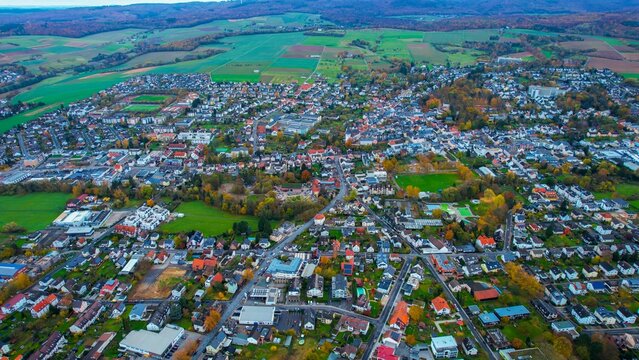 Aerial view of the old town around the city Bad Camberg on an overcast day in fall in Germany.	