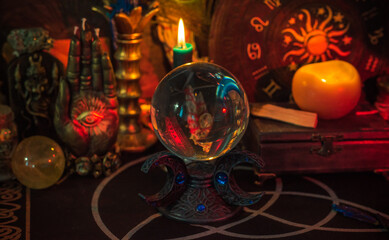 Table with candles and esoteric stuff. Herbs and wax around. Rite concept  © T.Den_Team