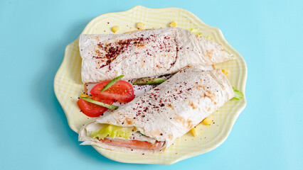 Sliced durum kebab on plate top view