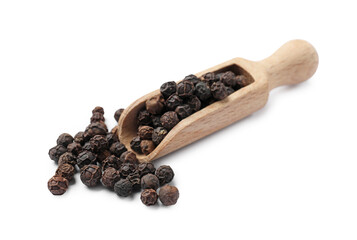 Aromatic spice. Many black peppercorns in scoop isolated on white