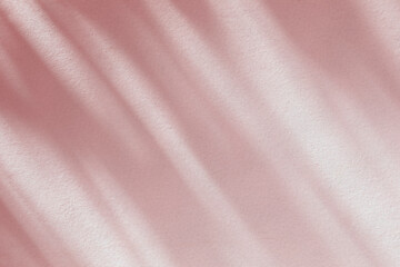 Fototapeta premium Abstract light shadow of pink leaves bokeh background. Natural diagonal leaves tree branch pastel beige shadows and sunlight on wall. Shadow overlay effect foliage mockup, graphic layout, wallpaper