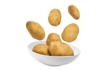 Potatoes flying over white bowl
