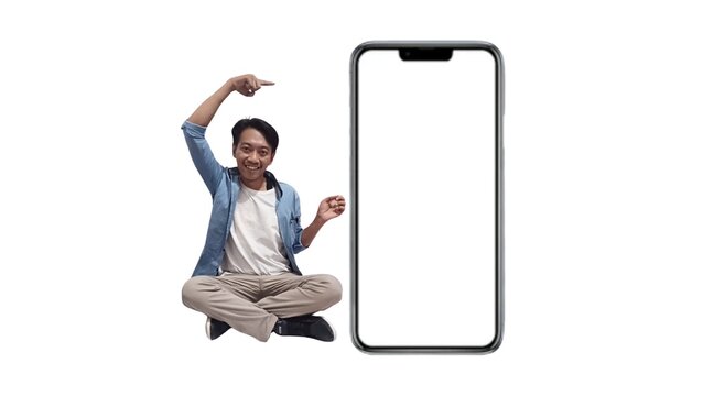 Full size photo of handsome young Asian man pointing excited device empty screen isolated on white color background