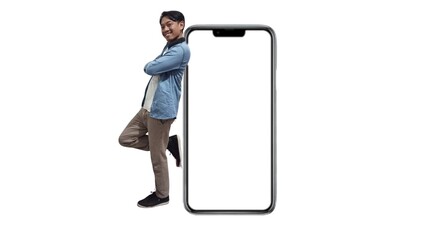 Full body photo of Handsome asian man posing folded hands next to mobile promo isolated on white...