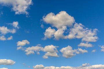 Obraz premium blue sky with clouds and sun reflection.The sun shines bright in the daytime in summer 1