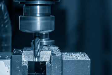 The slot cutting  process on NC milling machine with flat end mill tools.