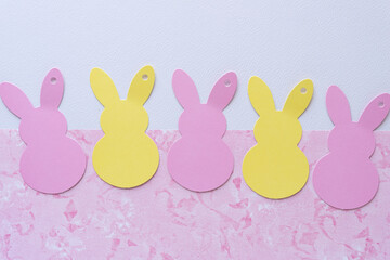 retro paper tags die cut in the shape of bunnies on scrapbooking and plain paper