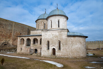 Ancient Church of the Assumption of the Blessed Virgin Mary on a March day. Ivangorod fortress. Russia - 759850902