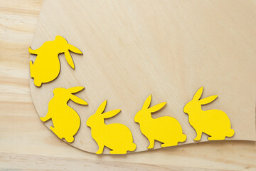 yellow rabbits on a wood shape