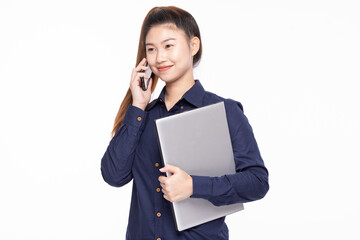 Asian professional businesswoman talking on a smartphone while holding a laptop, against a white background