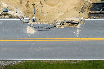 Destroyed bridge after hurricane flooding in Florida. Construction roadwork site. Reconstruction of...