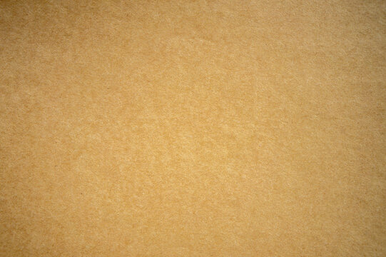 A large-size photograph of a cardboard sheet of paper. A blank cardboard sheet for the text.The texture of old paper.