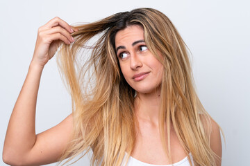 Fototapeta premium Young caucasian woman isolated on white background with tangled hair. Close up portrait