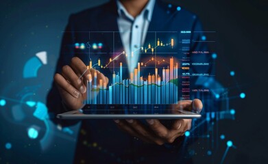 The businessman holds a tablet and analyzes quotes and ratings on a hologram.