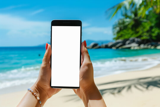 Mockup Image of a Woman Holding Smartphone With Blank Screen on the Paradise Beach