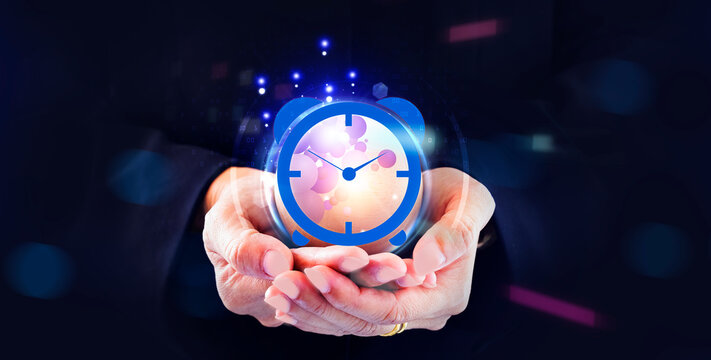 hand holding clock in the virtual screen, call center service concept.