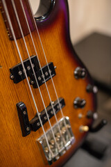 close up of a brown bass guitar