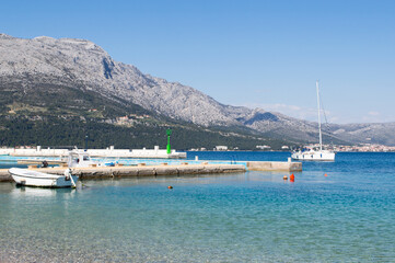 Mountains in Peljesac and harbor in town Korcula in Croatia, summer vacation on Adriatic coast